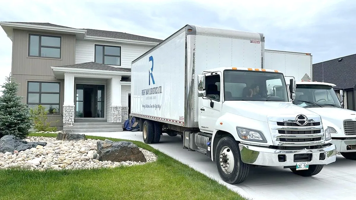 Right Way Logistics truck parked outside a Winnipeg home on moving day